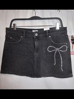 Black Denim Mini Skirt with Rhinestone Bow Accent